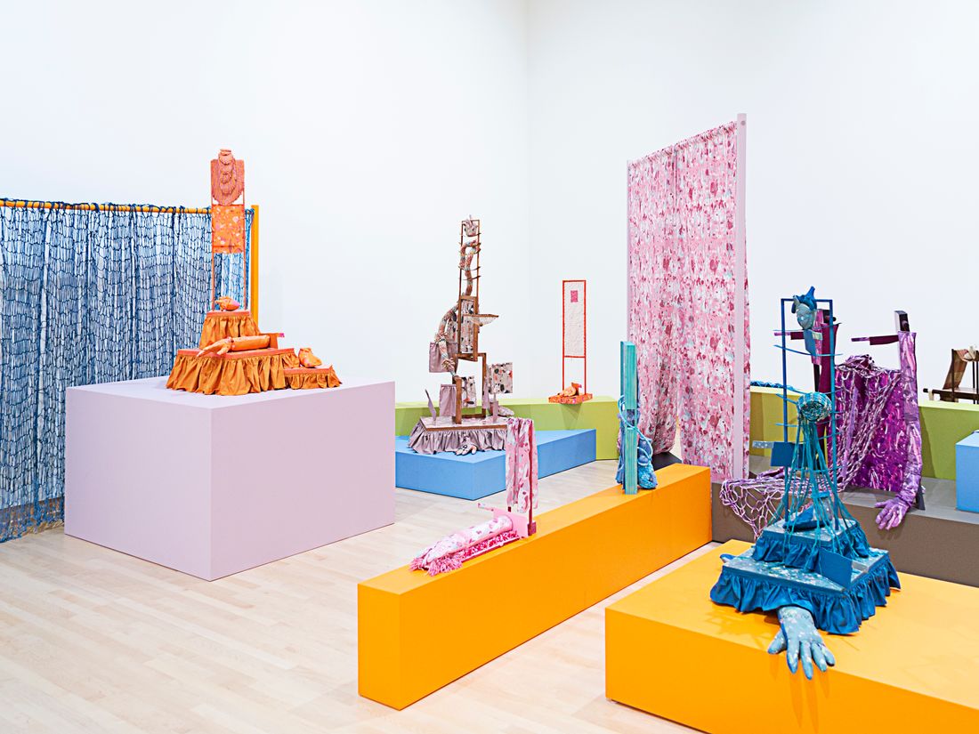 Installation view of a group show, titled High Touch, curated by Kaytie Johnson at John Michael Kohler Arts Center, Sheboygan, Wisconsin, USA. The installation is based on a typical 1960s ranch house façade, which is flattened and then used as a floorplan for plinths and walls for the 17 sculptures to inhabit. The foundation for each sculpture is a constructed and dyed wooden frame dressed with different fiber techniques, such as weaving (using an 8-shaft floor loom), dyeing, repeat pattern printing on cotton and wallpaper, coiling, tufting, embroidery, crocheting, knitting, netting, and sewing by hand and machine.