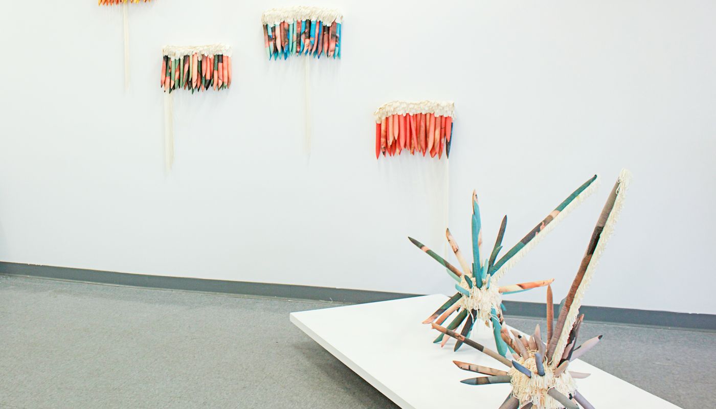 Install shot of wall and floor sculpture.